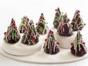 FNK MOIST CHOCOLATE CAKE XMAS TREES
Food Network Kitchen
Food Network
Sugar, AllPurpose
Flour, Cocoa Powder, Baking Powder, Baking Soda, Salt, Eggs, Milk,
Vegetable Oil, Vanilla Extract, Semisweet Chocolate, White Chocolate, Red and Green Mini
Candy Covered Chocolates, Silver Dragee