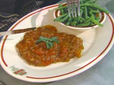 For dinner tonight, try Alton Brown's Swiss Steak cutlets from Good Eats on Food Network, cooked in bacon drippings and smothered in an oniony beef gravy.