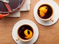 Warm up with a pot of Ina Garten's Mulled Wine recipe, a mix of apple cider and red wine infused with cinnamon, cloves and orange, from Barefoot Contessa on Food Network.