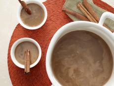 Rachael Ray's hot buttered rum from Food Network is a classic warm drink to serve at a holiday party.