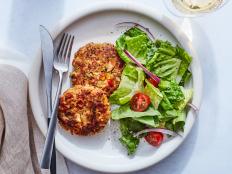 For an elegant main course, serve Ina Garten's Salmon Cakes, made with a mix of fresh veggies, capers and Old Bay, from Barefoot Contessa on Food Network.