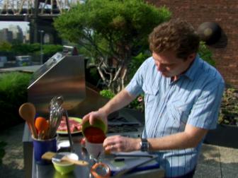 Host Bobby Flay creates a meat rub for before the grilling starts.