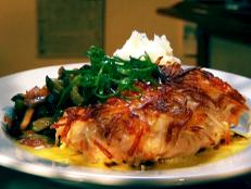 <p>Guy says, "the pork chops are the size of Cleveland"; they're so enormous, they can easily be a combo of two chops made into one. Paris-trained Chef Rick Valenzuela serves up unique concoctions like Rick's salmon in Potato, which is glued together with his salmon paste.</p>