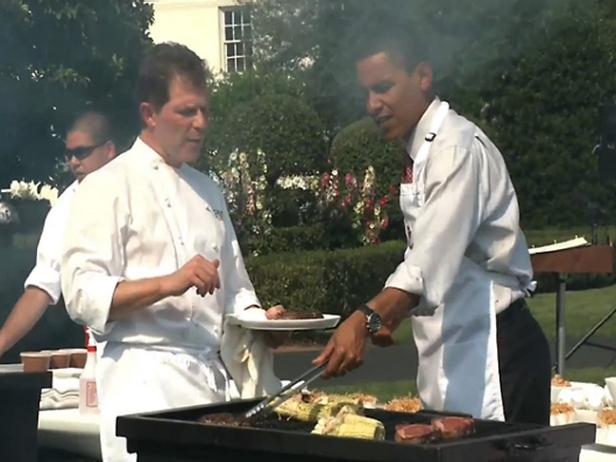 Bobby Flay cooks an outdoor meal with President Barack Obama.