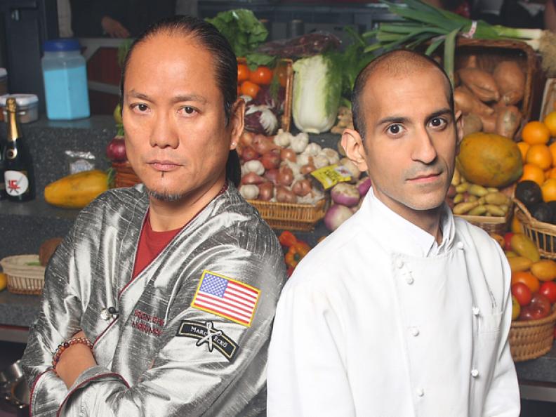 Masaharu Morimoto and Jehangir Mehta standing next to each other in front of baskets of fruits and vegetables