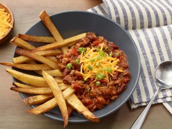Dragons breath chili served with fries and topped with cheese and green onion.