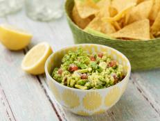 Hand-squeezed lemon juice is the key to freshness for this easy guacamole recipe from the Barefoot Contessa's Ina Garten fresh, as featured on Food Network.