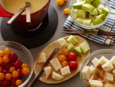 Tyler Florence's classic Cheese Fondue recipe is super easy. With a mix of Swiss and Gruyere cheese as the base, it'll be perfectly creamy; serve with chunks of bread, apples and vegetables for a party favorite.