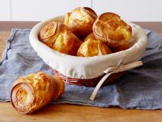 There are three secrets to great popovers: Make sure the pan is hot before you pour in the batter, fill each section not more than half full and no peeking while they're in the oven! Ina Garten's popover recipe is sure to be a hit at your holiday table.