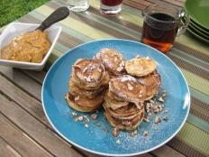 Try Bobby Flay's perfect silver dollar buttermilk-pecan pancakes with bourbon molasses butter and maple syrup recipe from Food Network.