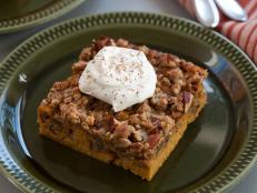 Bake Aida Mollenkamp's Pecan Pumpkin Crunch recipe from Food Network for a festive fall or Thanksgiving dessert.