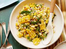 Take advantage of summer's seasonal bounty with Ina Garten's easy Fresh Corn Salad recipe from Barefoot Contessa on Food Network, made with fresh basil.
