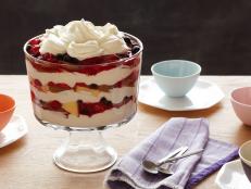 Tyler Florence's berry trifle recipe from Food Network has strawberries, raspberries and blueberries layered between lots of whipped cream.