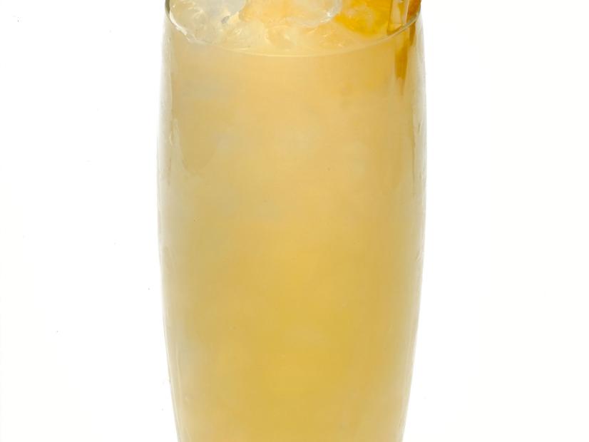A Harvey Wallbanger cocktail garnished with an orange slice in a highball glass