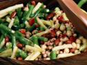 Five bean salad with champagne vinaigrette is made with a mixture of green beans, yellow wax beans, kidney beans, black-eyed peas, and garbanzo beans.