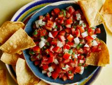 Marcela Valladolid makes her Pico de Gallo recipe with a perfect balance of sweet yellow tomatoes and serrano chiles, which are a bit spicier than jalapenos.