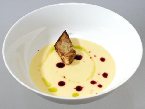 Yukon Gold Potato Soup with Chive Oil, Beet Reduction and Sweet Garlic Confit Croutons