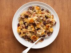 Serve Anne Burrell's Sausage Cornbread Stuffing recipe from Food Network for Thanksgiving dinner.