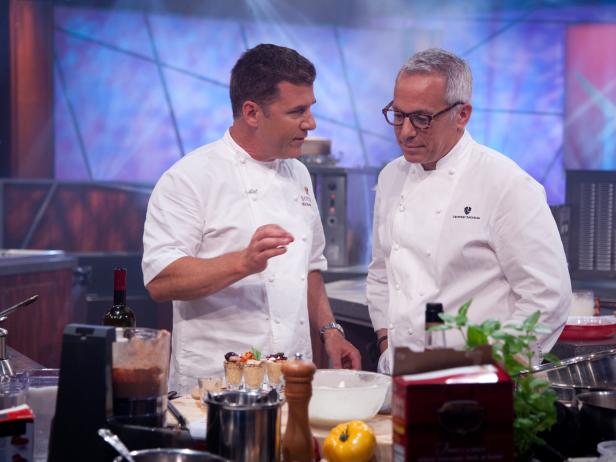 Rival-Chef Geoffrey Zakarian checkin in with Rival-Chef Michael Chiarello during his head-to-head battle against Rival-Chef Elizabeth Falkner in Episode 7 Secret Ingredient "Keebler Town House Crackers & Wine" Showdown as seen on Food Network Next Iron Chef Season 4.