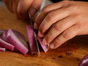 Slicing A Purple Onion Into Thin Rings
