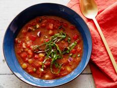 For a bright, refreshing summer soup, try Alton Brown's Gazpacho recipe, loaded with fresh, crunchy vegetables and herbs, from Good Eats on Food Network.
