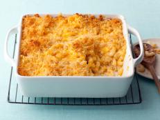 Get Alton Brown's Baked Macaroni and Cheese from Good Eats on Food Network, a classic recipe made with cheddar cheese and topped with buttery breadcrumbs.
