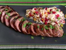 Alton Brown's Grilled Pork Tenderloin recipe, from Good Eats on Food Network, stays moist thanks to hours of soaking in a sweet and sharp lime-based marinade.
