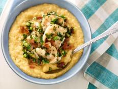 Bobby Flay takes Southern-style Shrimp and Grits to the next level by adding sharp cheddar, bacon and lime juice in this easy recipe from Food Network.