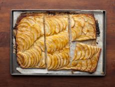 Bake Ina Garten's French Apple Tart recipe from Barefoot Contessa on Food Network with Granny Smith apples atop buttery, homemade pastry dough.