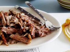 Get Melissa d'Arabian's slow-cooked Pork Carnitas recipe from Food Network, a fall-apart Tex-Mex meat dish spiced with oregano, cumin and orange.