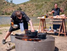 Food Network's culinary production team shares what was needed to pull off the wilderness "Heat and Meat" challenge on episode one of The Next Iron Chef.