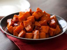 Tyler Florence's Roasted Sweet Potatoes from Food Network are made even sweeter and stickier with honey, cinnamon and 30 minutes in a hot oven.