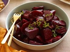 Ina Garten's Roasted Beets from Food Network are sweet, aromatic and slightly sharp from the raspberry vinegar and orange juice tossed in at the end.