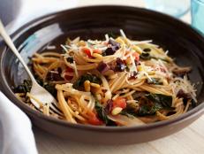 Food Network Giada De Laurentiis' Whole Wheat Spaghetti with Swiss Chard and Pecorino Cheese recipe.