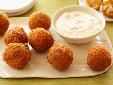 For a high-impact appetizer at your next party, serve Aaron McCargo Jr's Buffalo Chicken Cheese Balls from Big Daddy's House on Food Network.