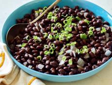 Get Melissa d'Arabian's Perfect Black Beans, subtly spiced with a splash of red wine and a hint of cumin, from Ten Dollar Dinners on Food Network.