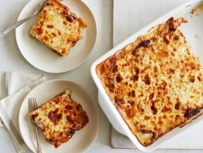 MOUSSAKA Melissa d’Arabian Ten Dollar Dinners/Greekonomical Dining Food Network Red Potatoes, Eggplant, Olive Oil, Onion, Ground Beef, Oregano, Cinnamon, Nutmeg, Garlic, Red Wine, Tomato Sauce, Butter, Flour, Milk, Vegetable Oil, Parmesan