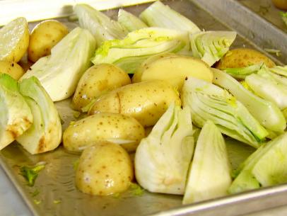All vegetables are chopped  and placed on the roasting pan.