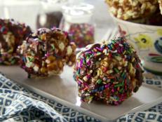 Your Halloween party needs these sweet and crunchy popcorn balls from Food Network.