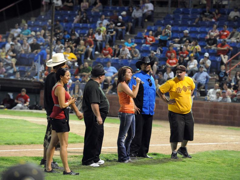 The different teams introduce themselves to the Amarillo Sox baseball fans as seen on the Food Network's The Great Food Truck Race, Season 3.