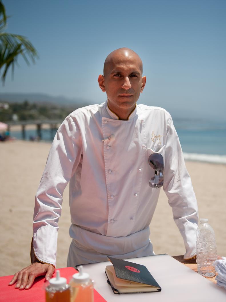 Rival Chef Jehangir Mehta awaits the Chairman's Challenge "Resourcefulness" as seen on Food Network's Next Iron Chef, Redemption, Season 5.