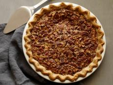 This classic Southern Pecan Pie recipe from Food Network Kitchen is spiked with bourbon and baked in a homemade buttery crust.