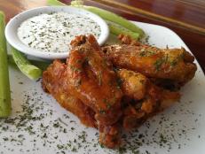 Make a play at these top chicken wing spots for the best game-day grub around.