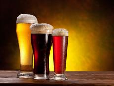 Beer glasses on a wooden table.