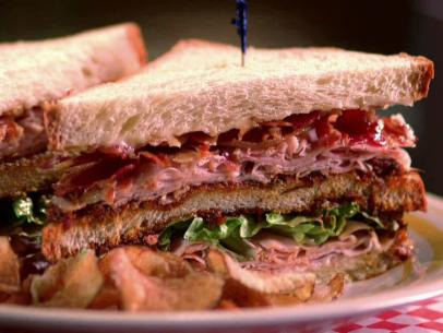 The playas club sandwich with meat and lettuce.