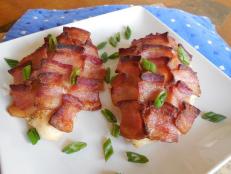 A little bit of bacon goes a long way in adding flavor and moisture to ordinary, lean chicken breasts.