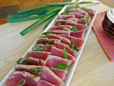 White rectangular platter filled with seared ahi tuna