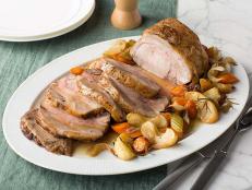 Feed a crowd with Food Network Kitchen's Roast Pork Loin with Apples recipe. The flavor comes from apple cider, apple cider vinegar and fresh apples.