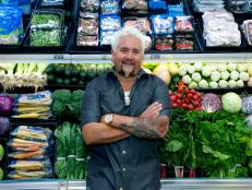 Host Guy Fieri poses during taping of Food Network's Guy's Grocery Games, Season 1.