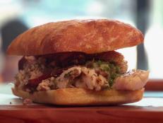Meat & Bread is a straightforward sandwich shop serving only four kinds of sandwiches a day, with a rotating daily menu. The staple is the porchetta sandwich with homemade salsa verde on a fresh ciabatta roll. Guy loves the juicy, tender and balanced flavors each bite brings.
